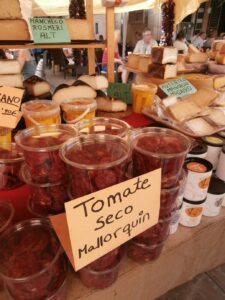 Mallorcan sun dried tomatoes and cheeses at market